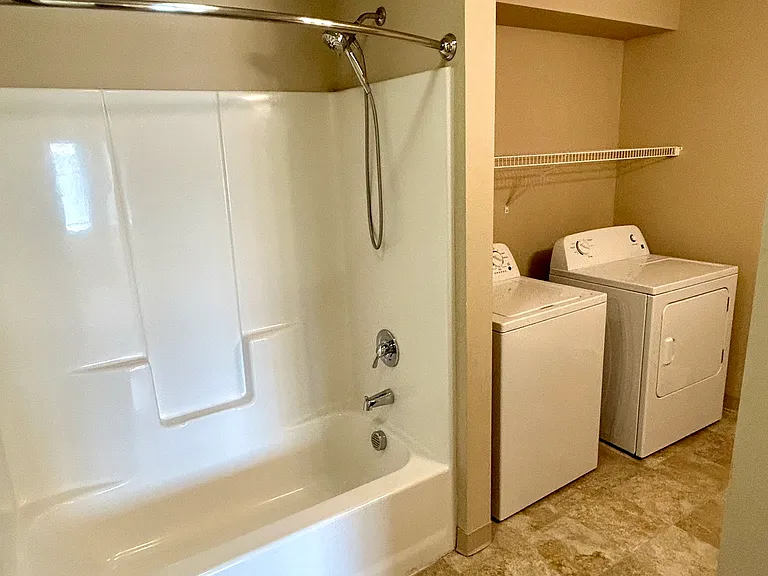 Secondary bathroom with laundry