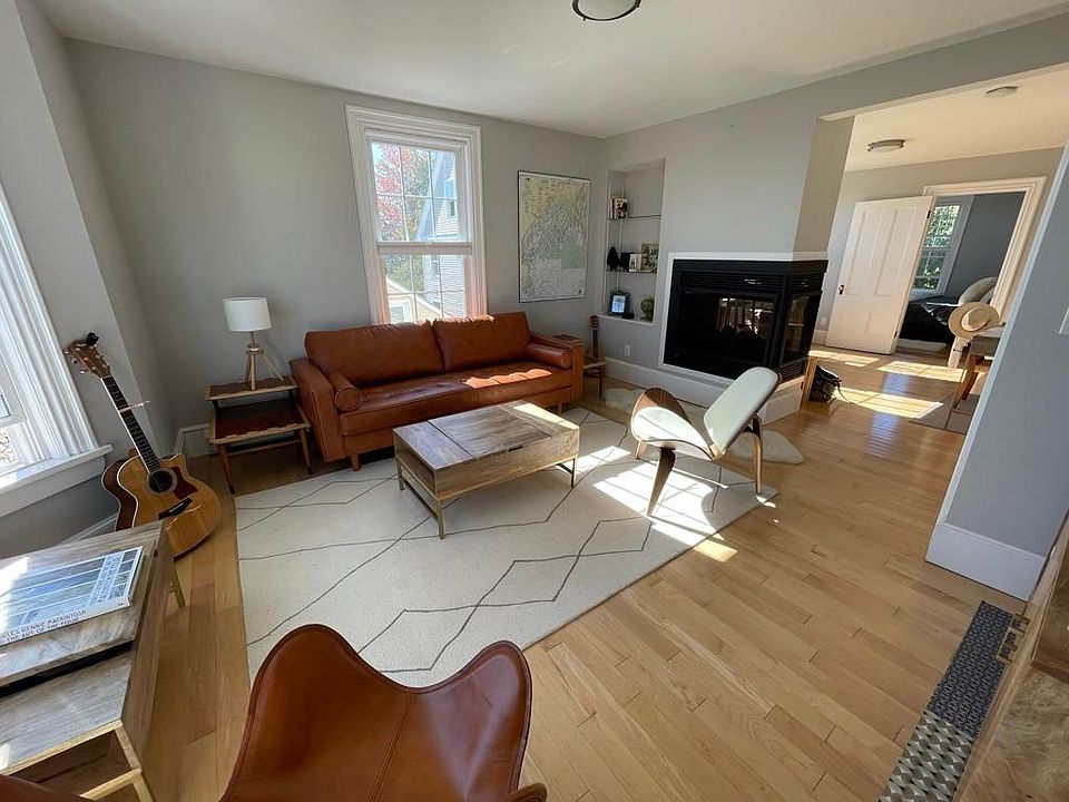 Living room has tons of light and lovely views. Leather, wool, wood and sheepskin make it a cozy spot in front of the fire. Insets in walls hold stuff and are lit from within. There is a record player for your enjoyment--Portland is a great place to go