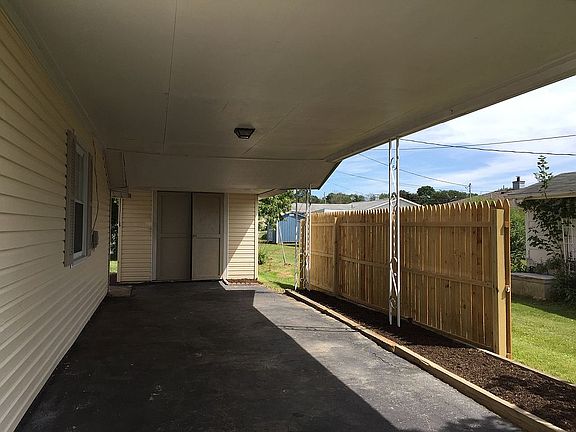 Carport with privacy fence