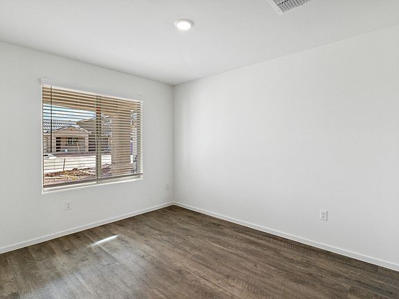 Formal dining room, located off the entry and connected to the kitchen.