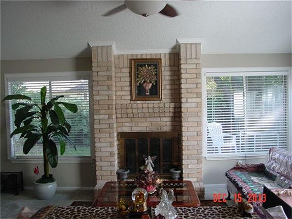 LIVING ROOM WITH WOOD BURNING FIREPLACE