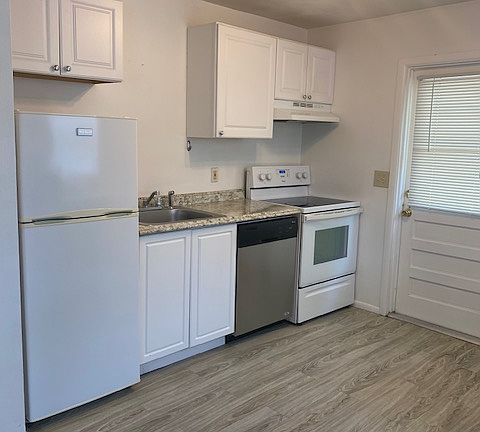 Kitchen with frig, dishwasher and stove