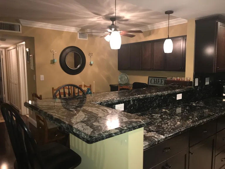 View from front door of kitchen and dinning room, dining room has office but in along back wall