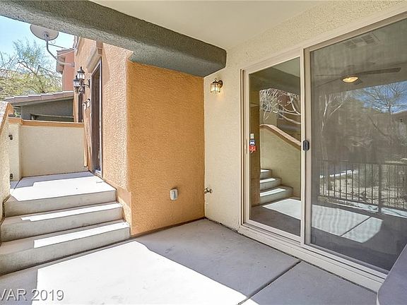 This covered patio is on the lower level and just outside from the downstairs den area.