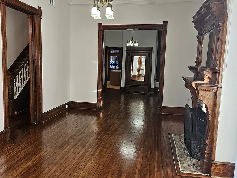 1st floor: living room, looking toward dining room and rear kitchen