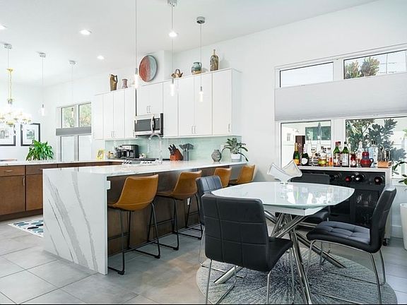 Dining area with bright window! All windows have levolor shades