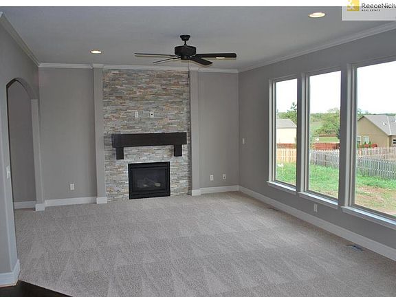 This room to have all hardwood floors, flowing well into the Hardwood flooring at Kitchen and Breakfast Room.  Stone does Not go all the way up to ceiling on  home for sale.