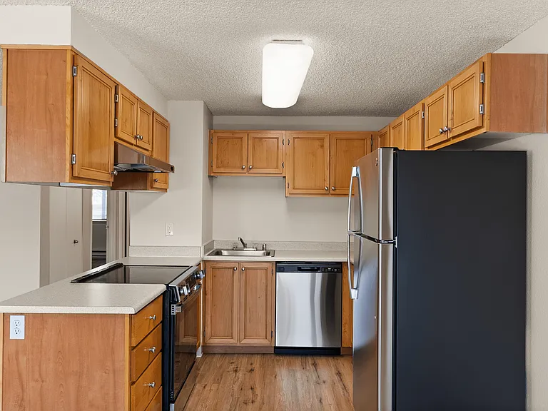 Cook in style with stainess steel appliances, warm wood cabinetry, and plenty of counter space in your updated kitchen. Cook in style with stainess steel appliances, warm wood cabinetry, and plenty of counter space in your updated kitchen.