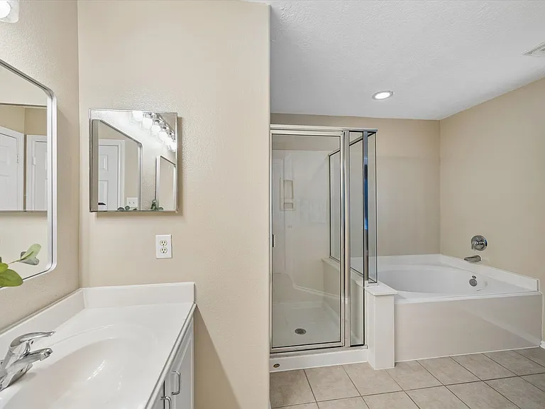 Double sink vanity with shower and tub