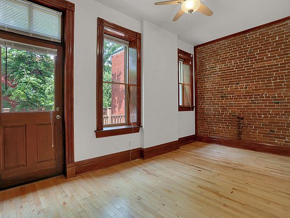 bedroom - exposed brick, hardwood floors