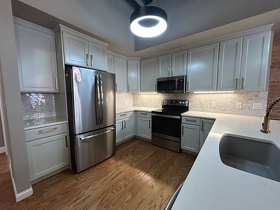 Kitchen w/ updated appliances & luxury finishes