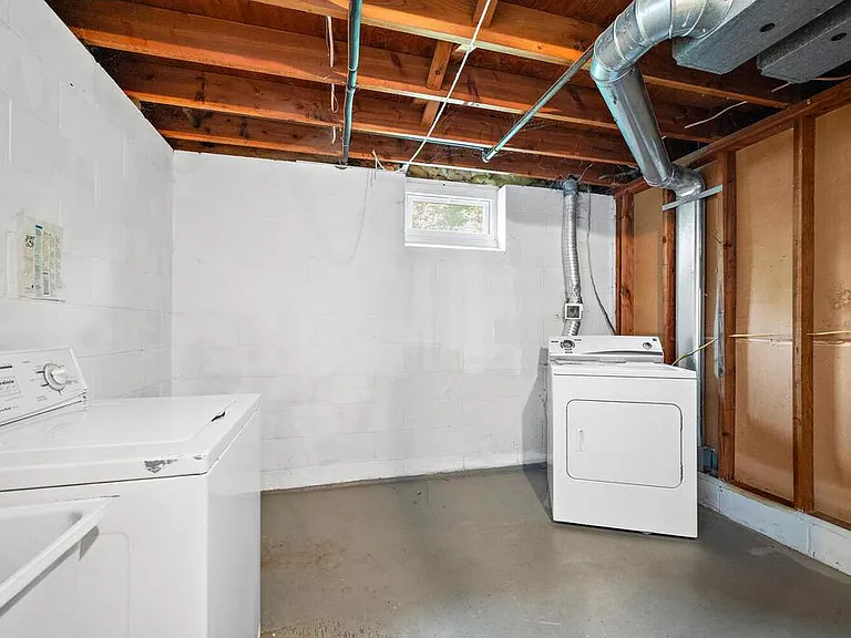 Lower level laundry room with new washer