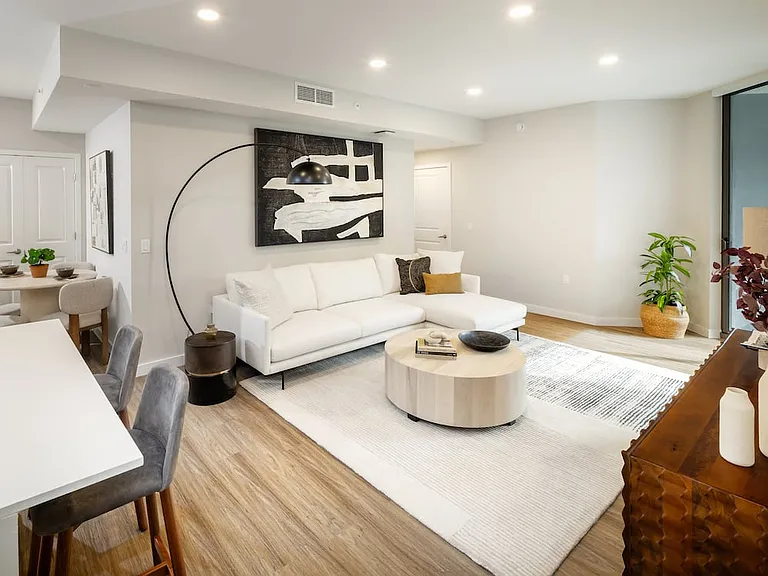 Kitchen, living, and dining areas with hard-surface vinyl plank flooring