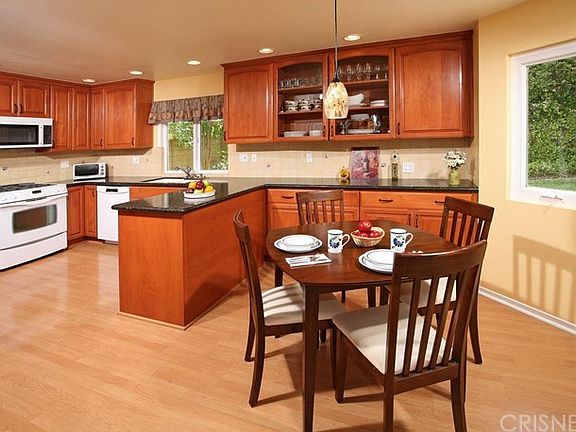 Abundant custom made Alder wood cabinets with buil