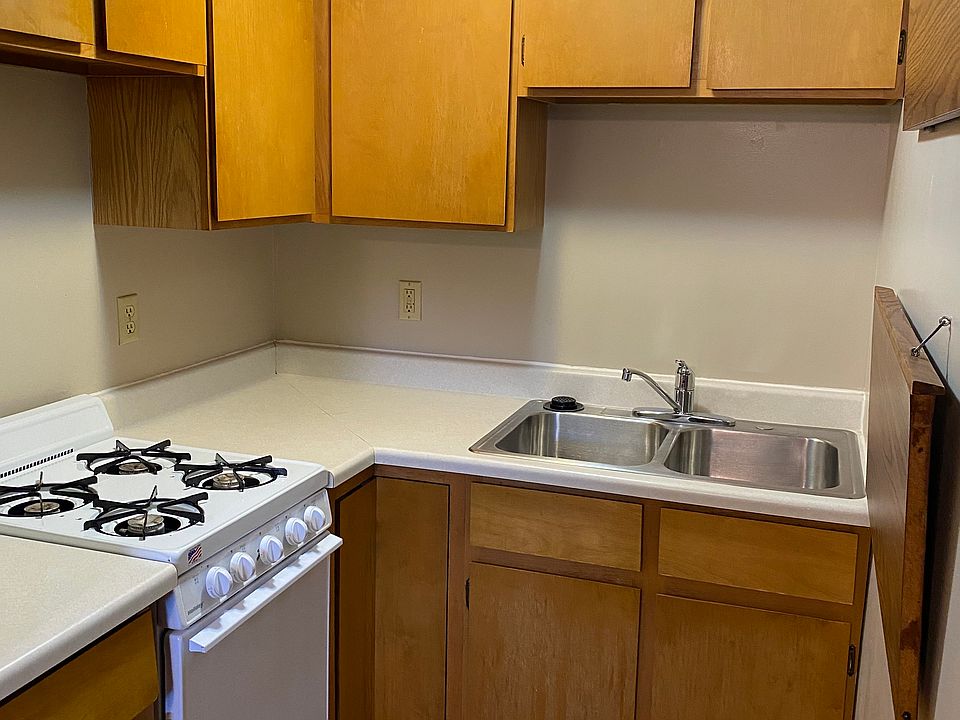 Efficient kitchen with gas stove top.