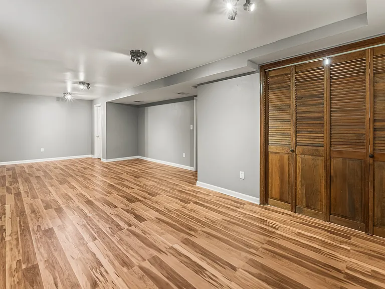 Large basement room can be used for a 4th bedroom, it has a closet in the back corner.