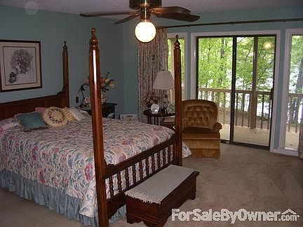 Large Master Bedroom
						:
						With sliding glass doors on to covered balcony overlooking the lake.