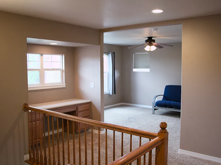 Top of stairs looking at built in desk and play area facing street