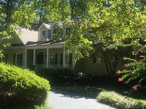 Front of house with convenient U shaped driveway.