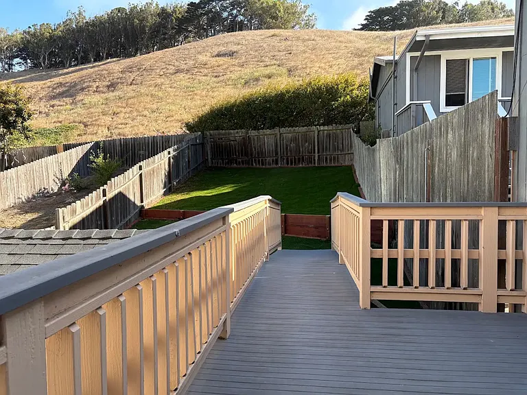 Deep backyard with a single standing storage structure