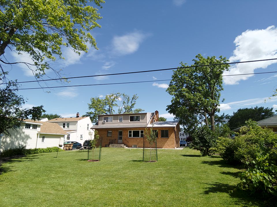 Back of the house - Backyard is quiet, secluded, green and the perfect place to enjoy your morning coffee or evening cookout.