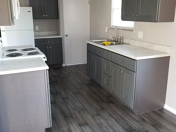 Kitchen with new cabinets, appliances and flooring