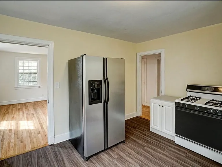 Kitchen 3 - looking toward living room (left) and hallway to bedroom (right)