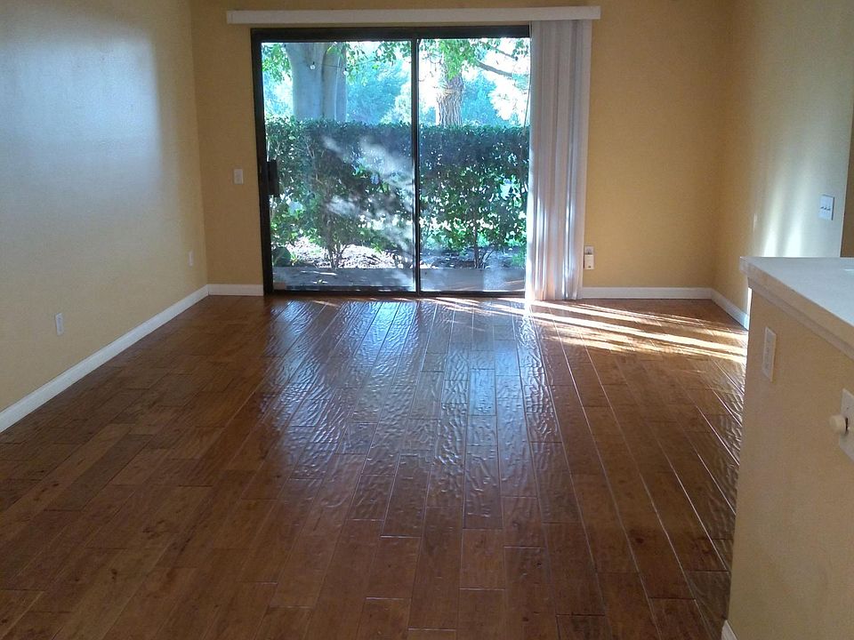 Living area view from dining area. Slider opens to small private patio