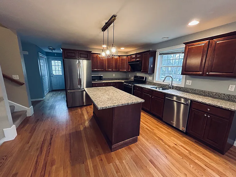 Upgraded kitchen with brand new appliances and gas stove