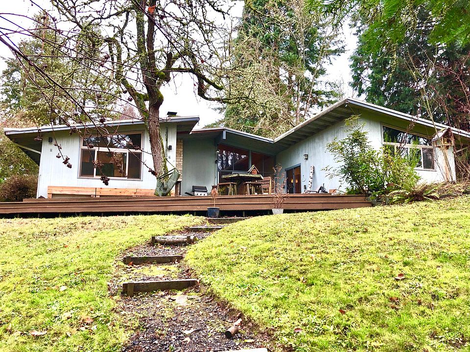The house as viewed from the trail coming up from the creek.