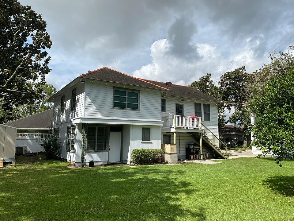 First floor front door into living room upstairs has a stair way with a porch with the bedrooms the dining room both bathrooms and the kitchen