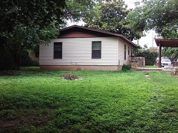 Large fenced yard and carport