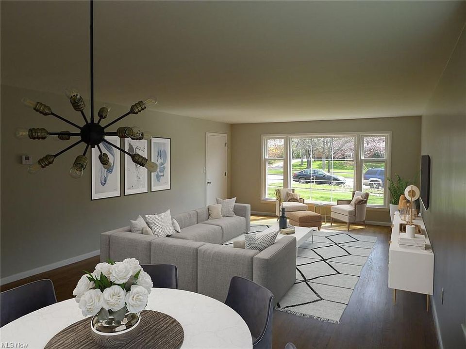 Living room and dining area - virtually staged.