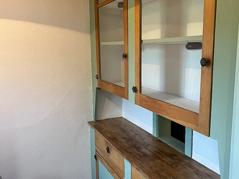 Built in china cabinet next to dinette / table