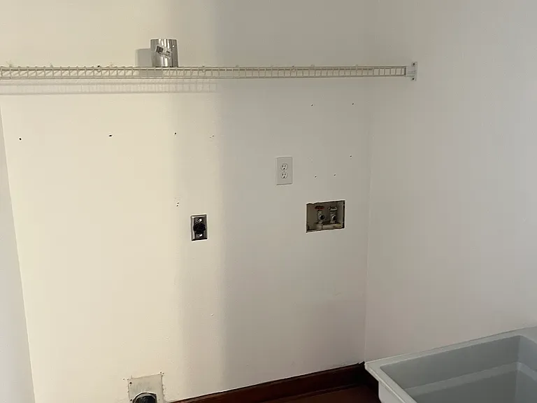 Laundry room w/hook ups and laundry tub