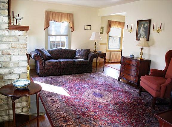 Large living room features hardwood floors.