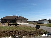 Chip and sealed driveway.  Add'l detached 24x30 ft to the left of home.