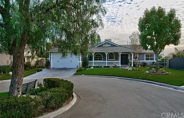 Inviting landscaped circle belongs to this property!