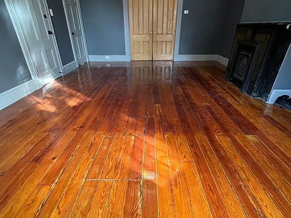 Beautiful granite fireplace and original wood floors