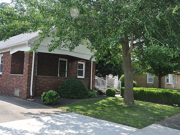 Covered porch & large drive