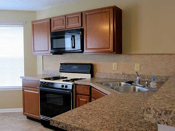 Kitchen. You can see how clean this home is.  The breakfast bar is in the right of this photo.