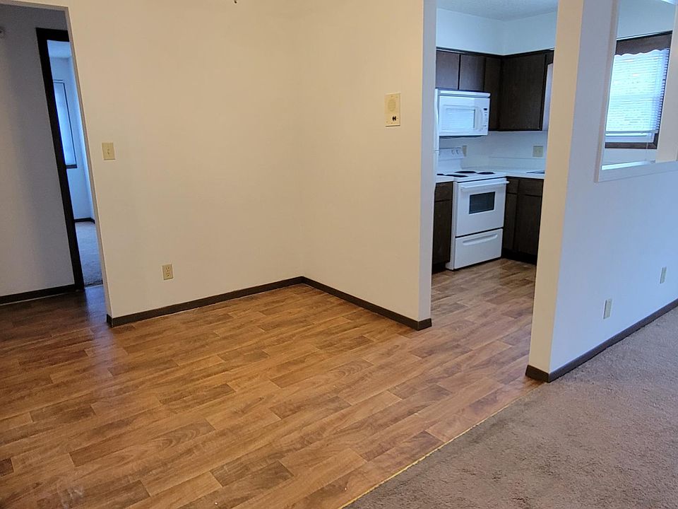 Another view of the dining area and kitchen