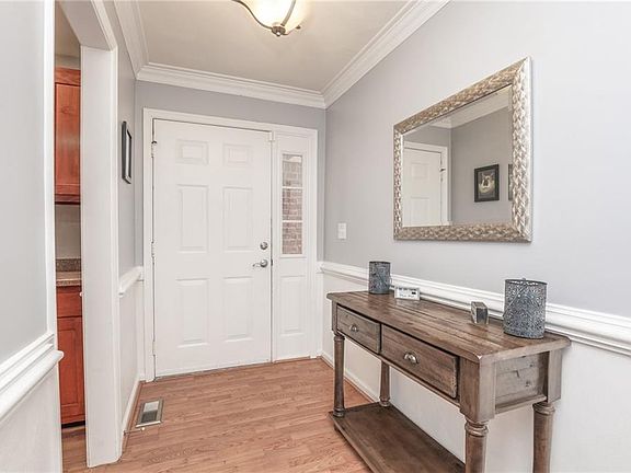 Front entryway leads to the kitchen and living room.