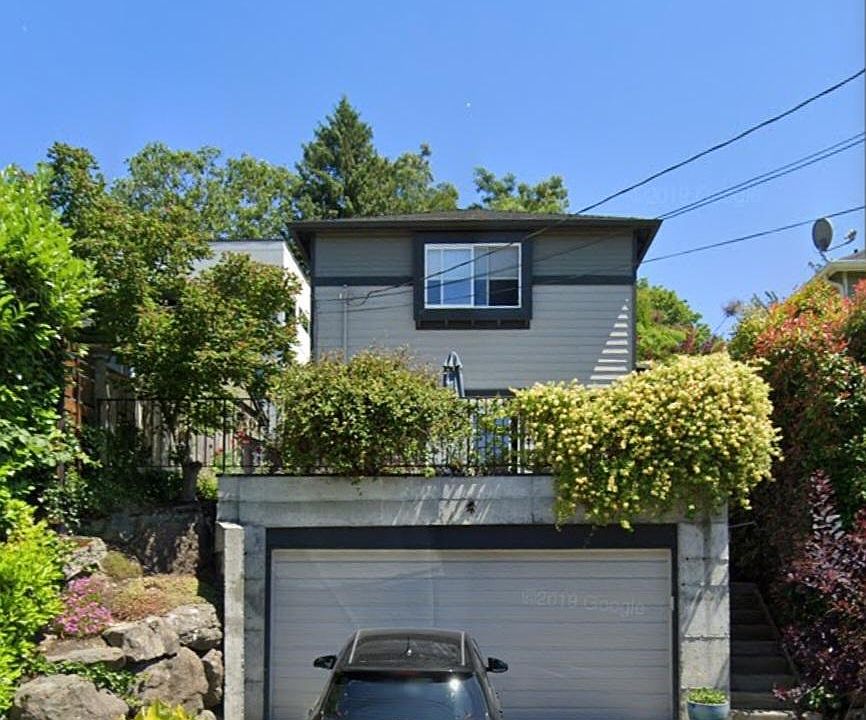 Exterior view from street. Shared garage. Unit is in the back.