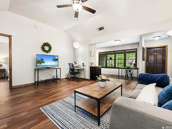 wide angle of living room with view to main bedroom