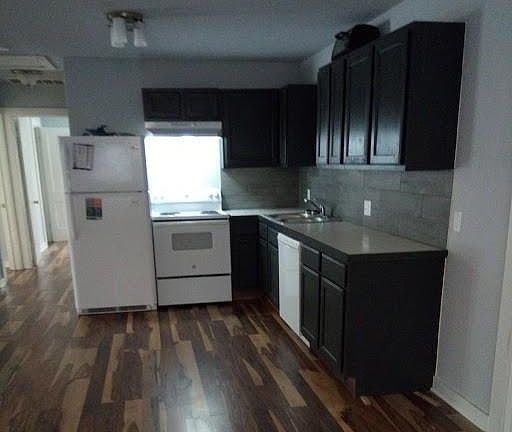 Open concept kitchen with stove, oven, dishwasher, refrigerator. Microwave is not included.