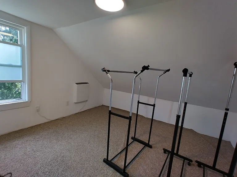 Attic room used as clothing storage room
