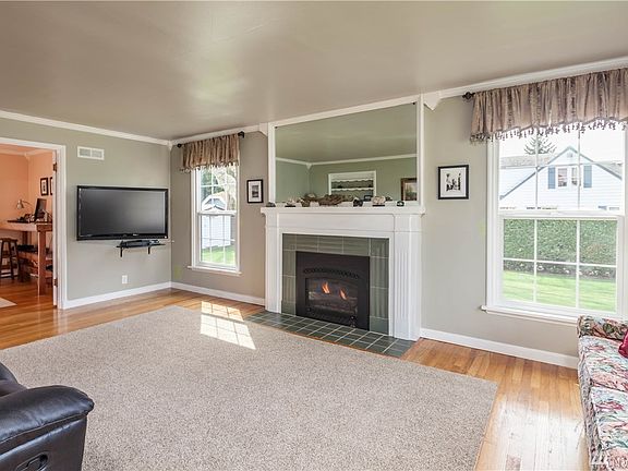Living room with gas fireplace and tile surround
