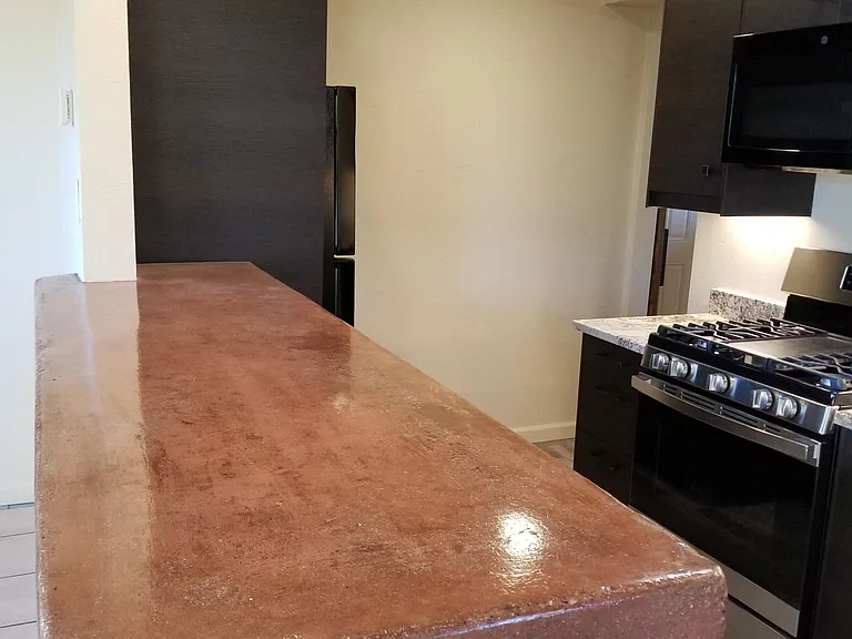 Concrete bar - an easy place to gather, eat, and prepare for the day/evening.
