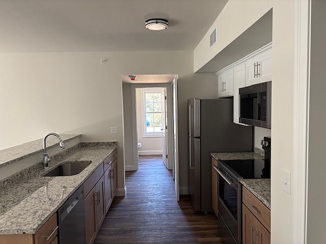 Full kitchen with granite countertops